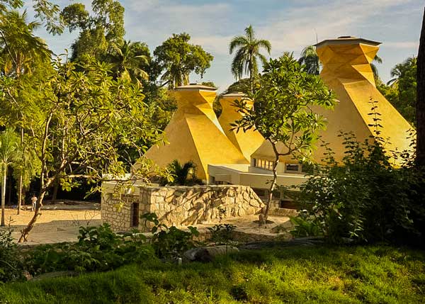 building with futuristic designed roof in public park