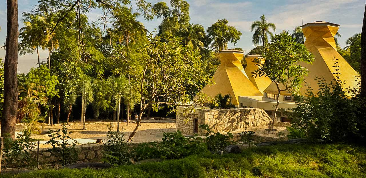 building with futuristic designed roof in public park