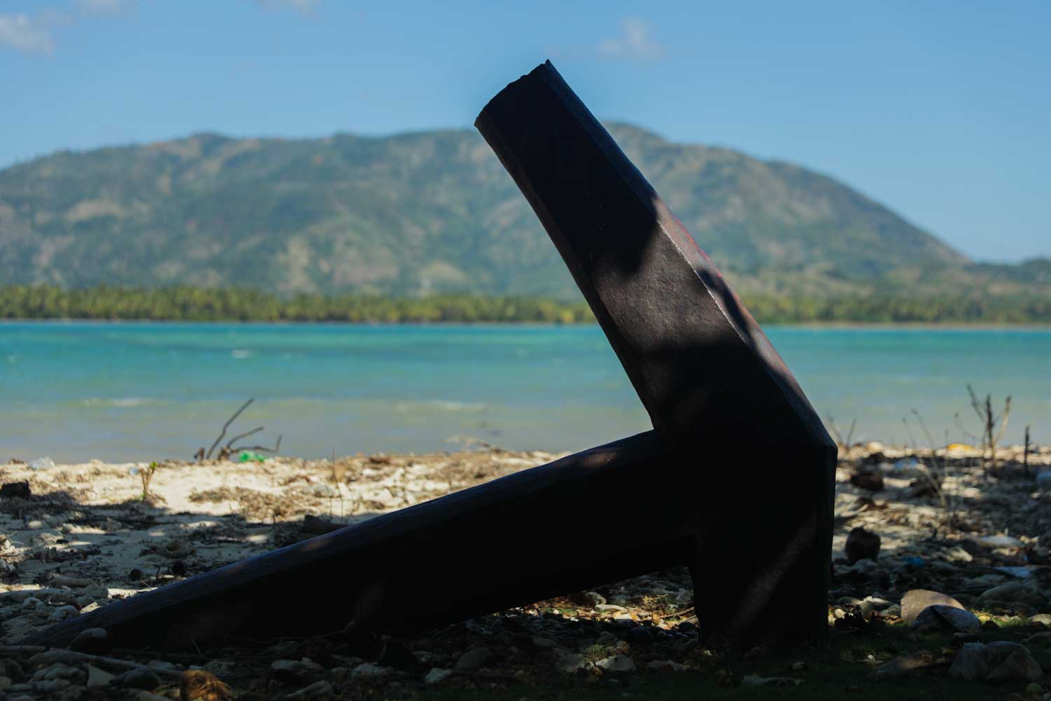 Anchor embedded in the beach at Fort des Anglais, Haiti