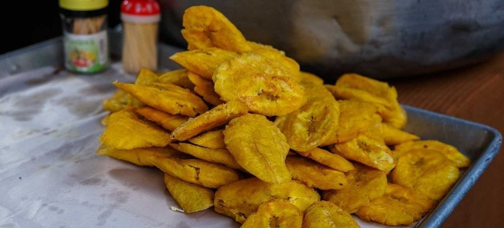 Fried plantains on display at a street food stall in Haiti