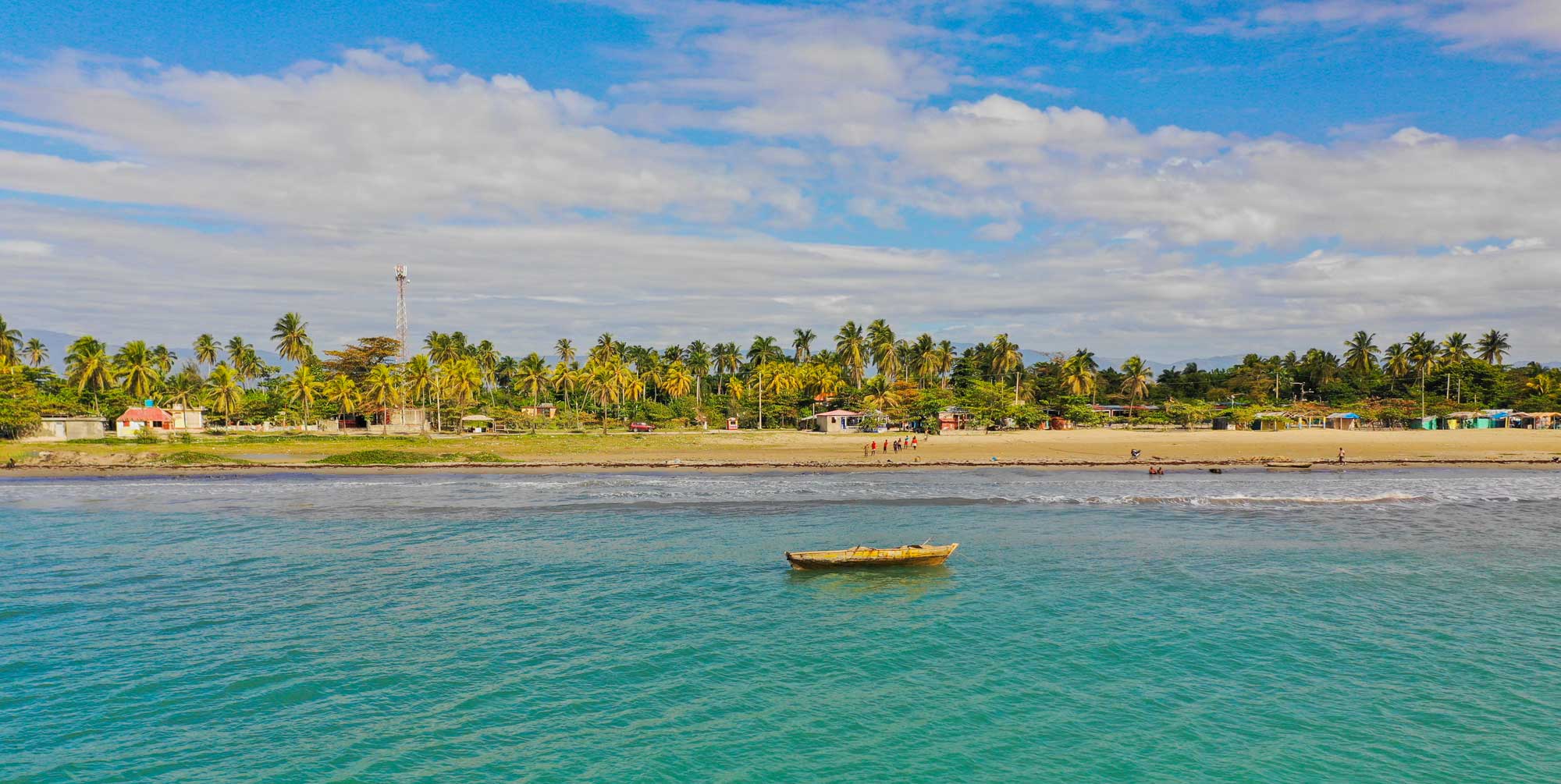 Boat anchored in turquoise water off Gelée Beach, Haiti