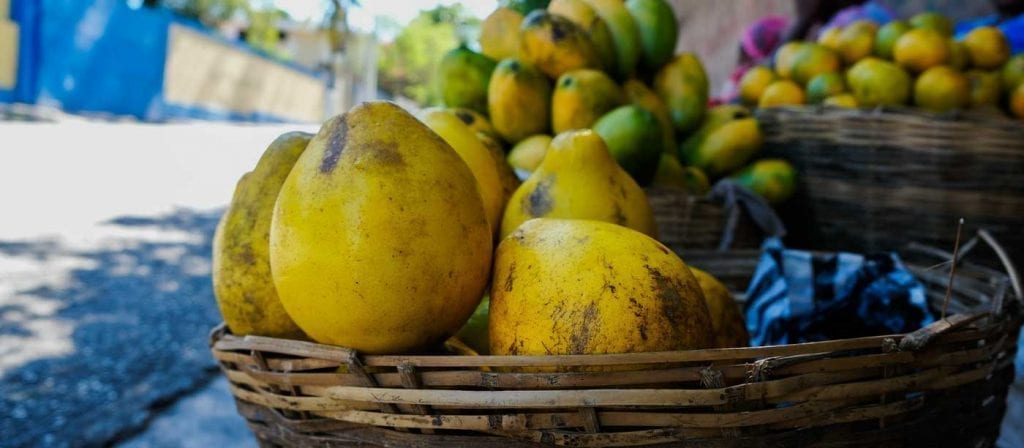 Basket of fresh grapefruits for sale at a produce market