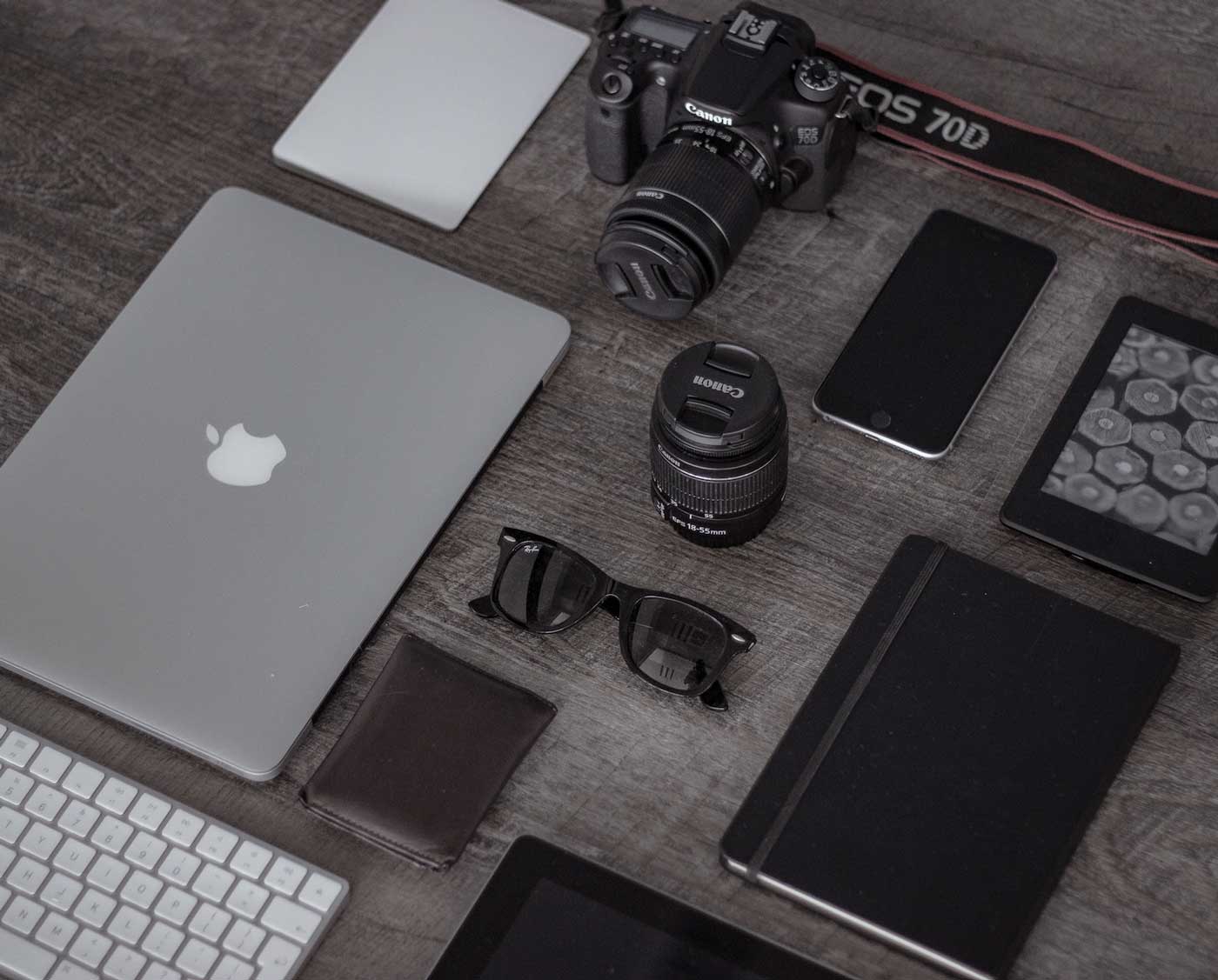 Electronics and travel essentials laid out ready to pack