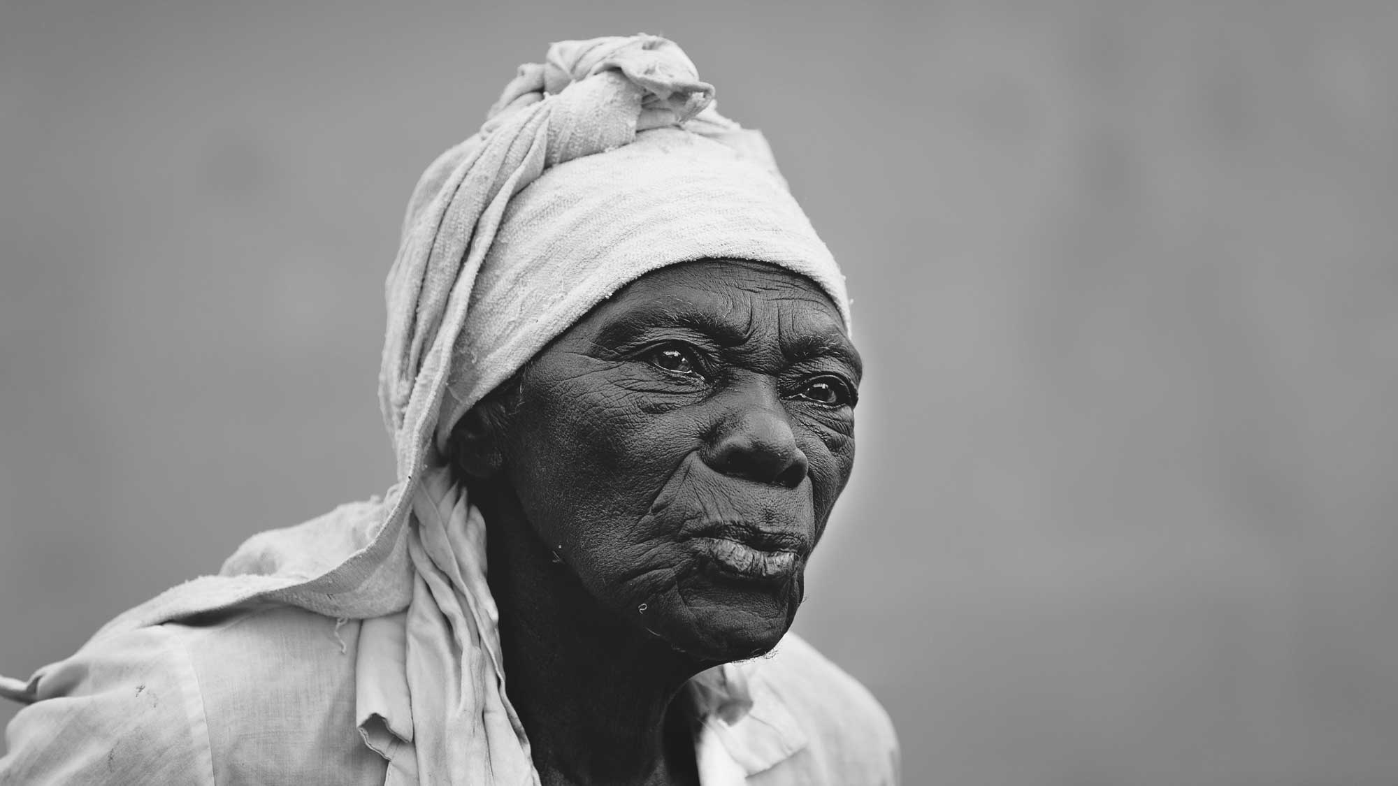 Black and white portrait photograph of an old Haitian woman