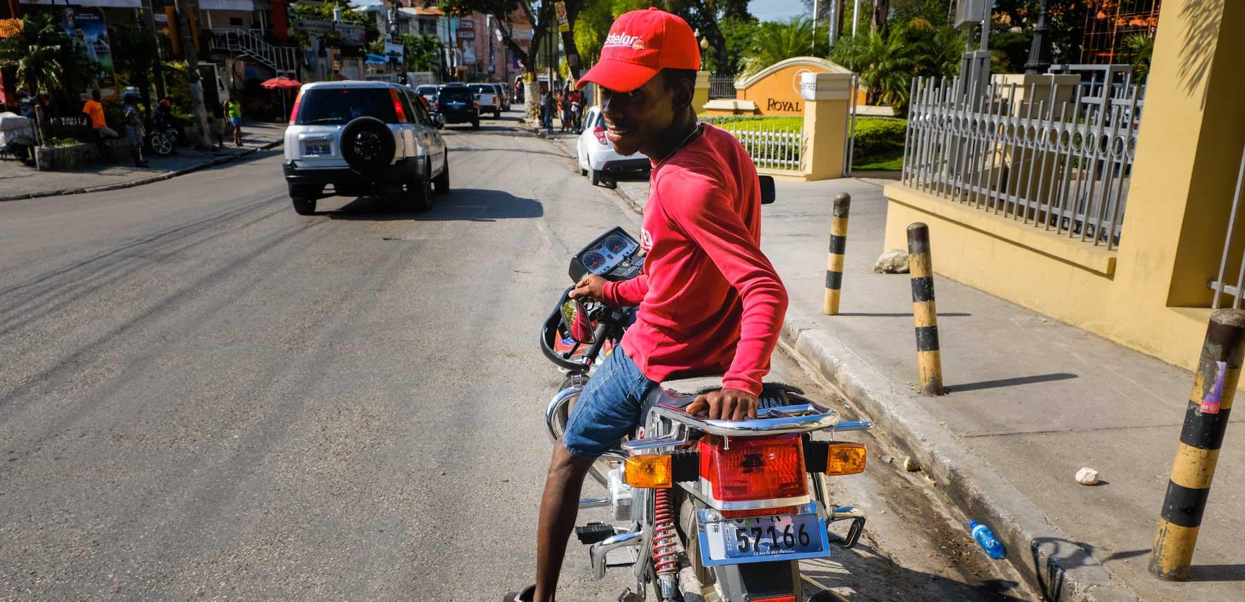 Moto driver smiling in Petion-Ville, Port-au-Prince, Haiti