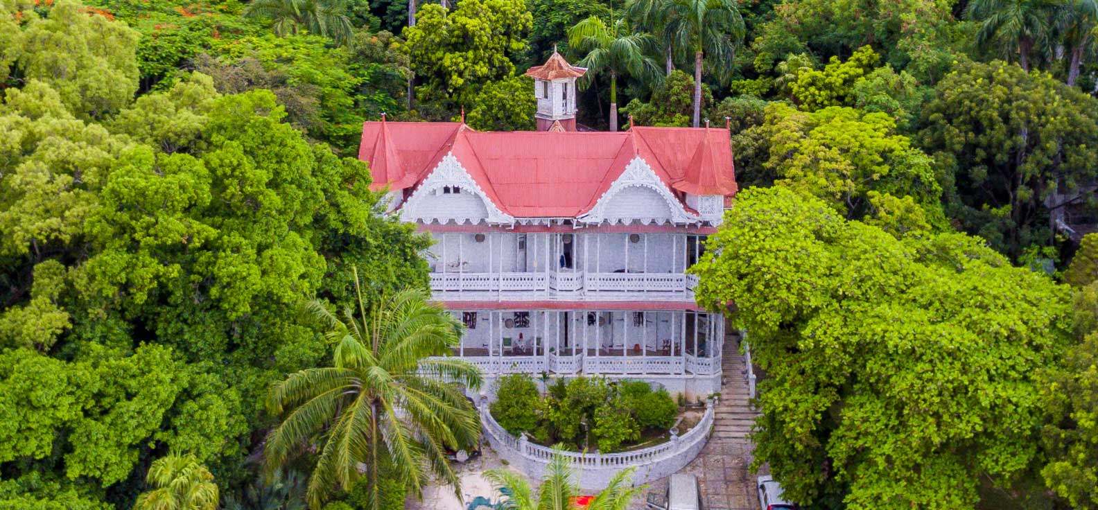 Aerial photo of the historic gingerbread building Peabody House in Pacot, Haiti