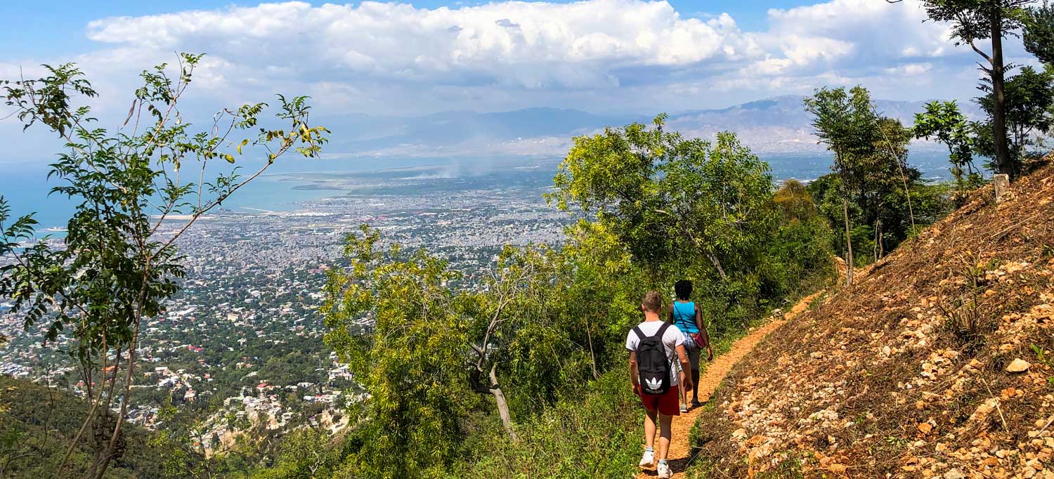 Two people hiking a trail above Port-au-Prince, Haiti