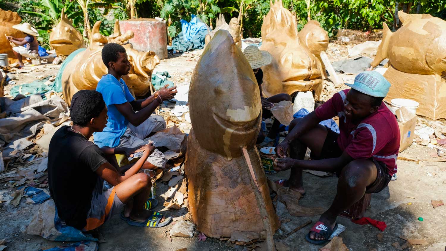 Artists in Jacmel, Haiti, working on paper mâché costumes