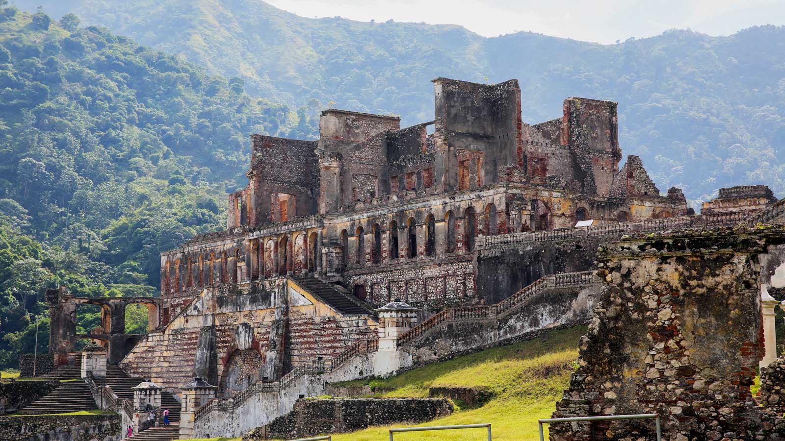 Sans-Souci Palace, Haiti, with tree-covered mountains in the background