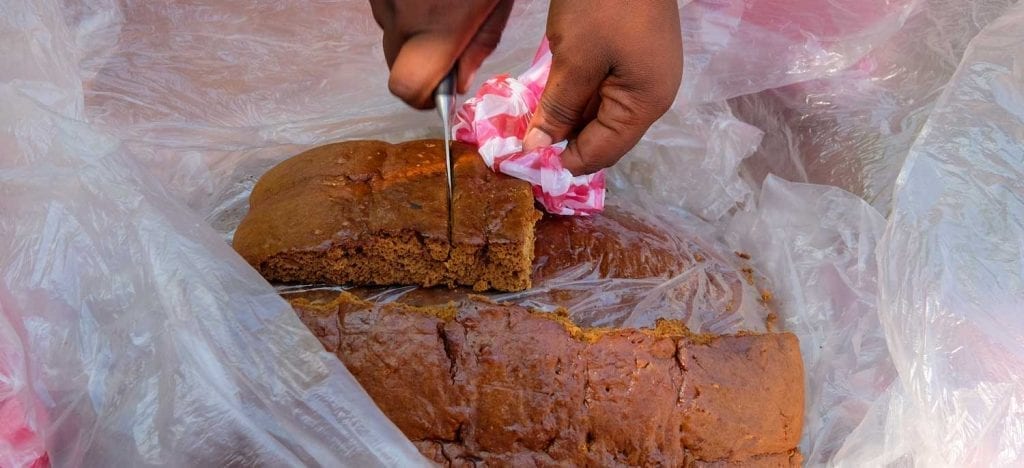 vendor cutting pieces of gingerbread