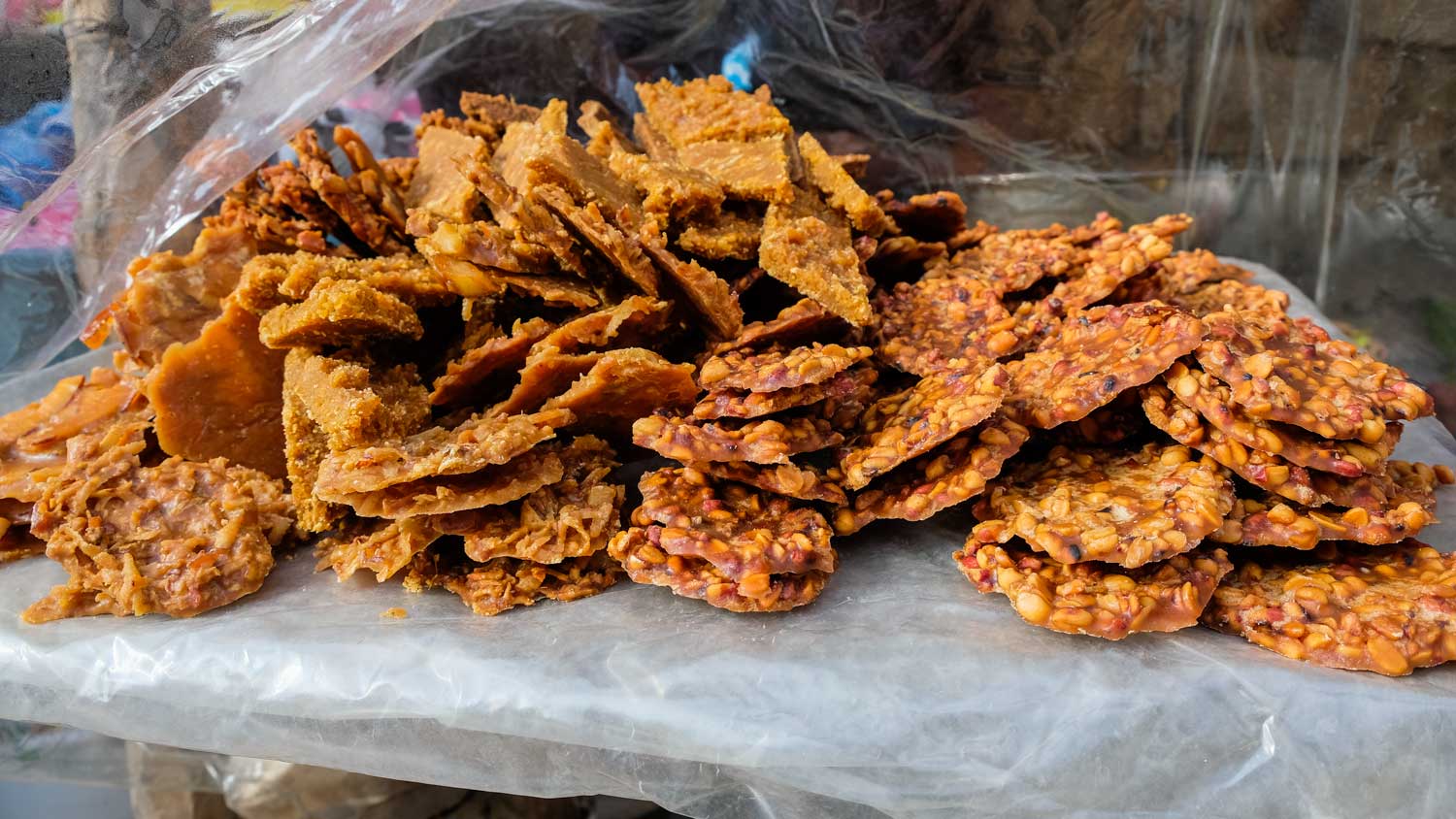 A pile of specialty Haitian sweets: Tablèt pistach and dous kokoye