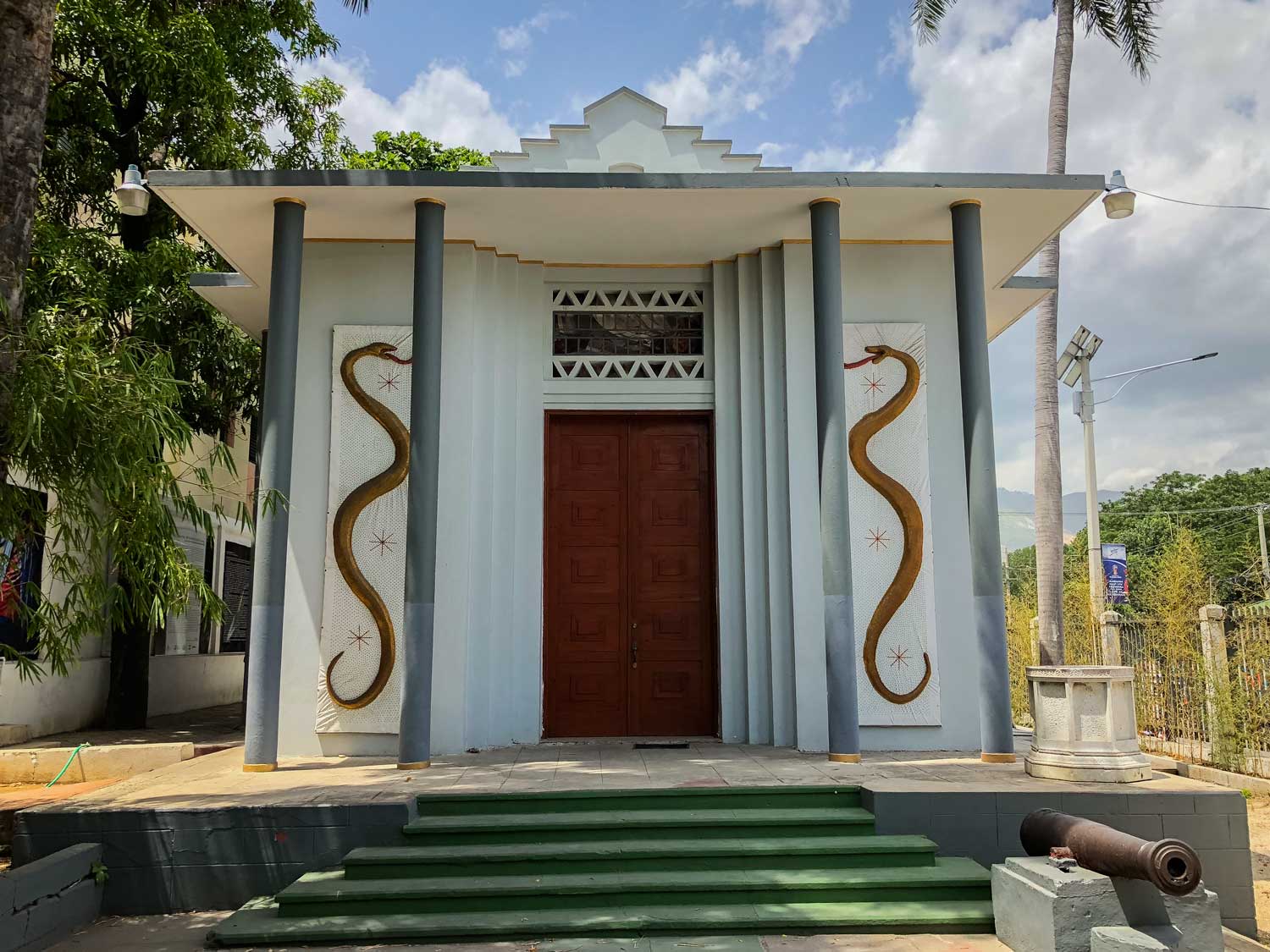 large museum building decorated with snake paintings