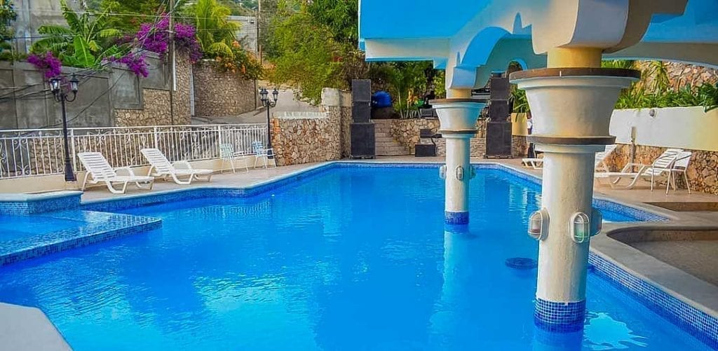 hotel pool with lounge chairs