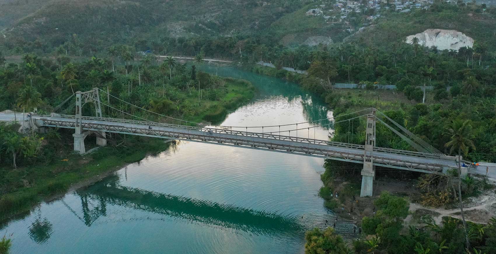 large suspension bridge crossing haitian river