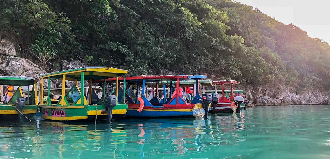 Colorful boat taxis line the shore at Cap-Haïtien, Haiti