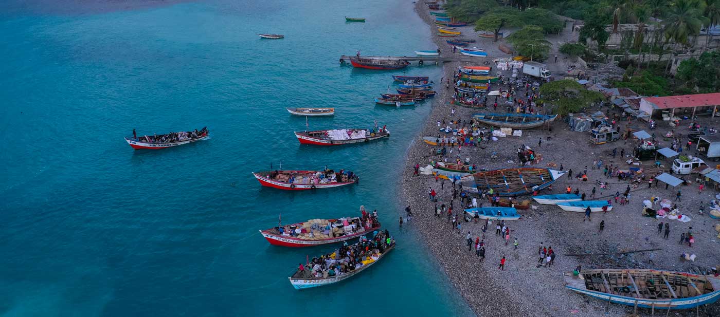 aerial view of port with boats and people