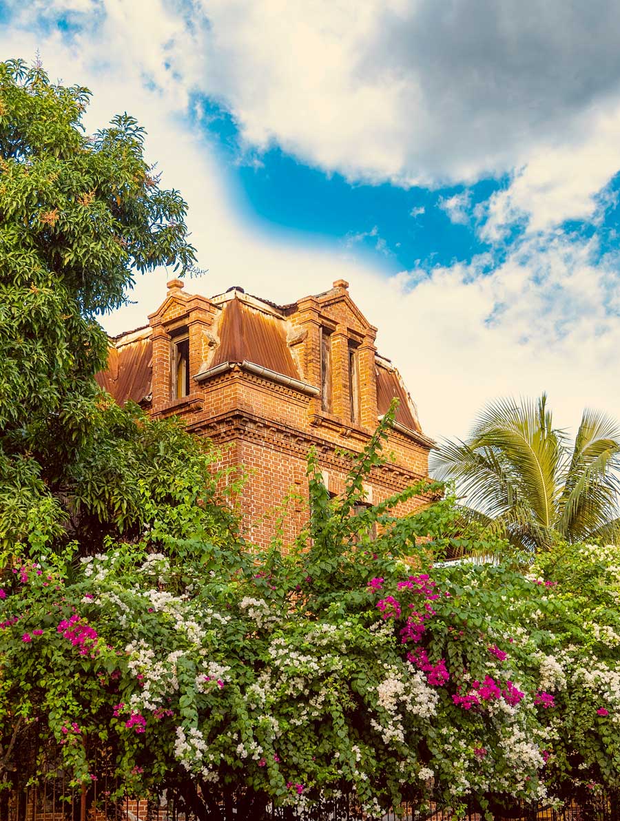 old colonial haitian house in tropical garden