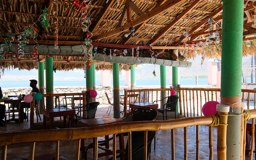 restaurant dining area with thatched roof