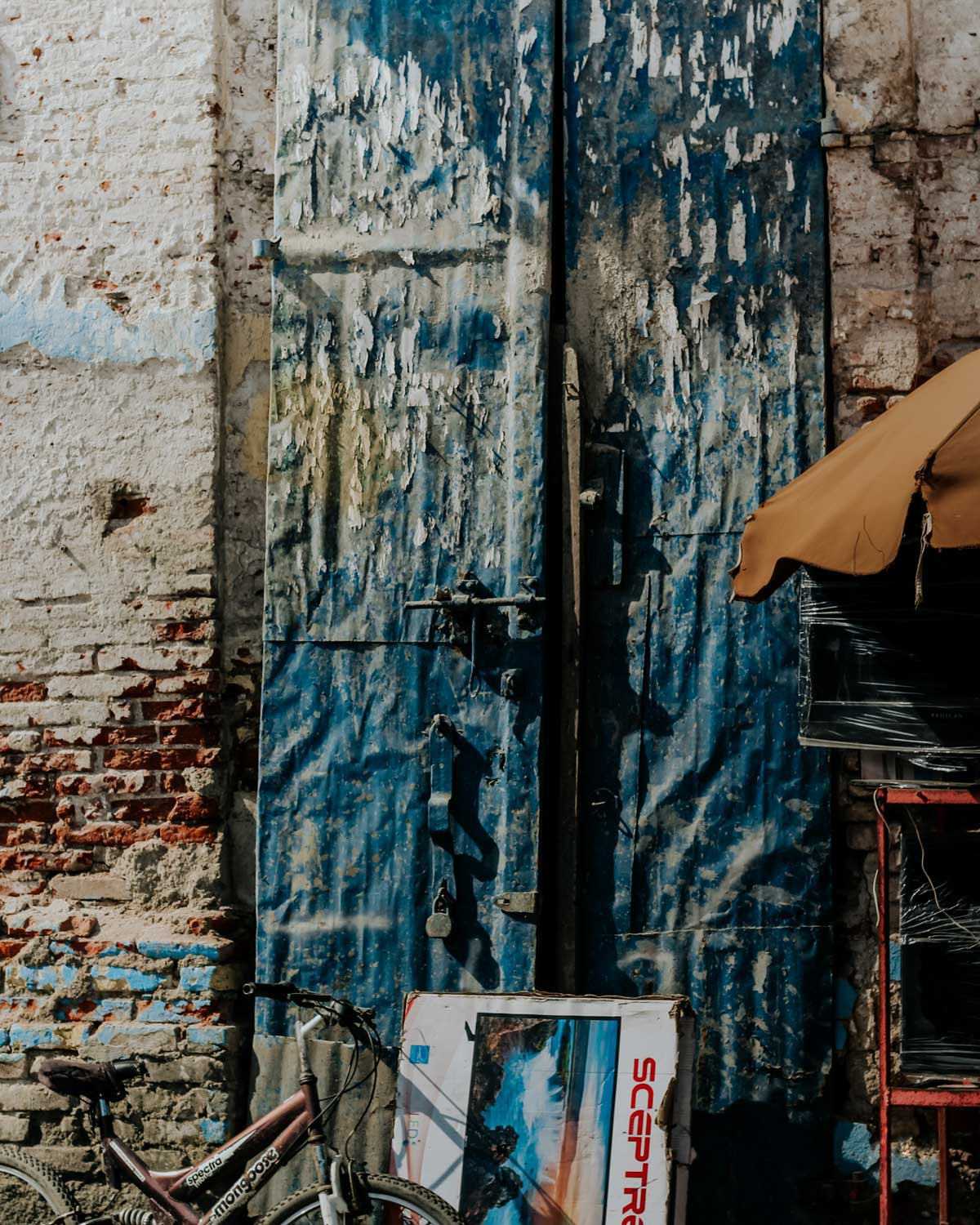 details of old colonial brick house with metal door