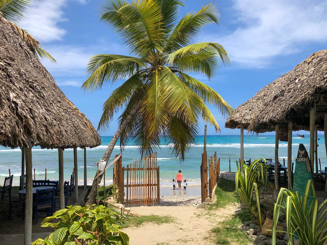 restaurant area with thatched roof by the beach