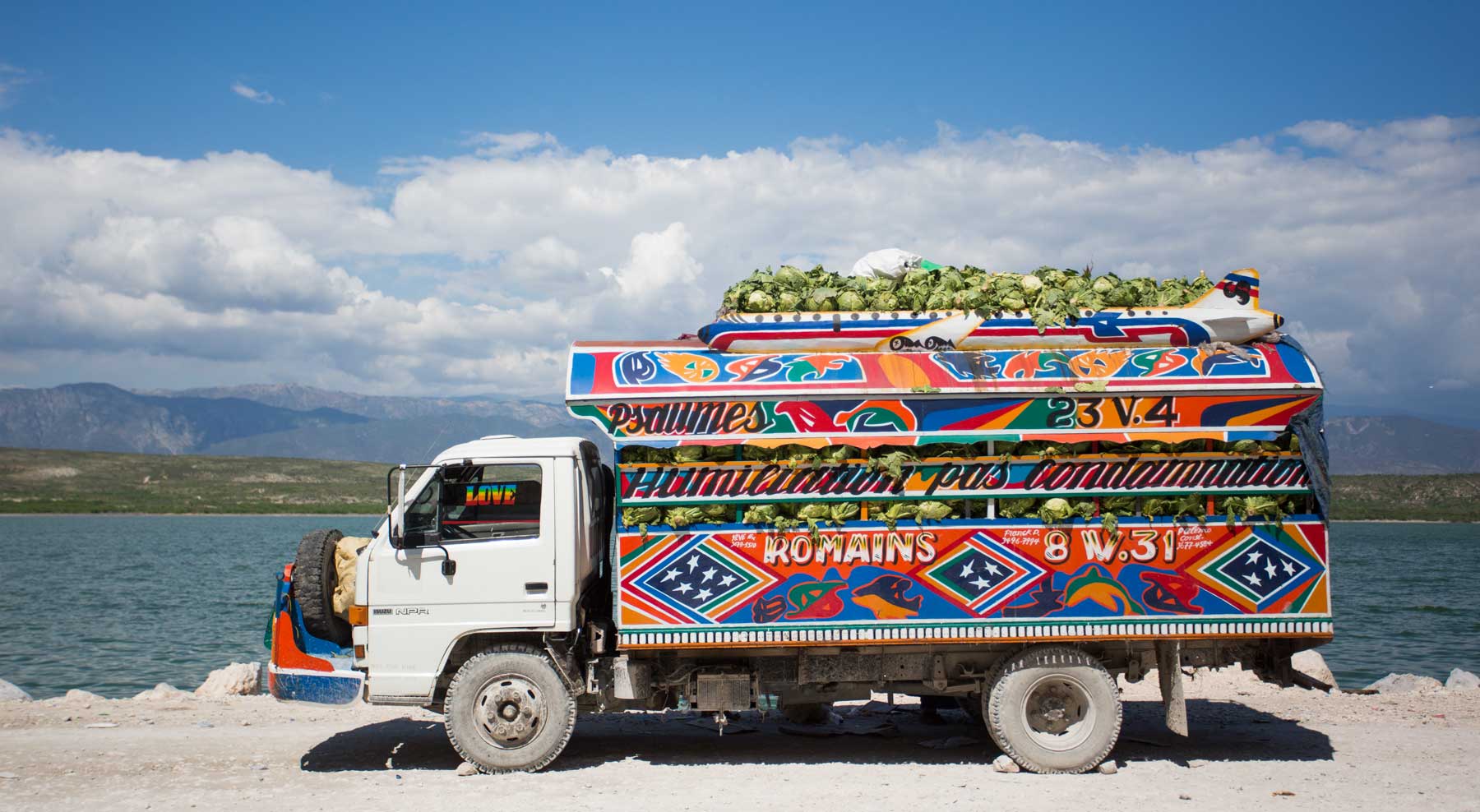 bright colorful haitian truck loaded with cabbage