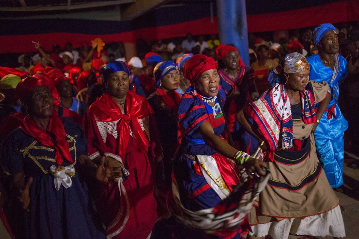 haitian vodou practitioners with head scarfs during ceremony