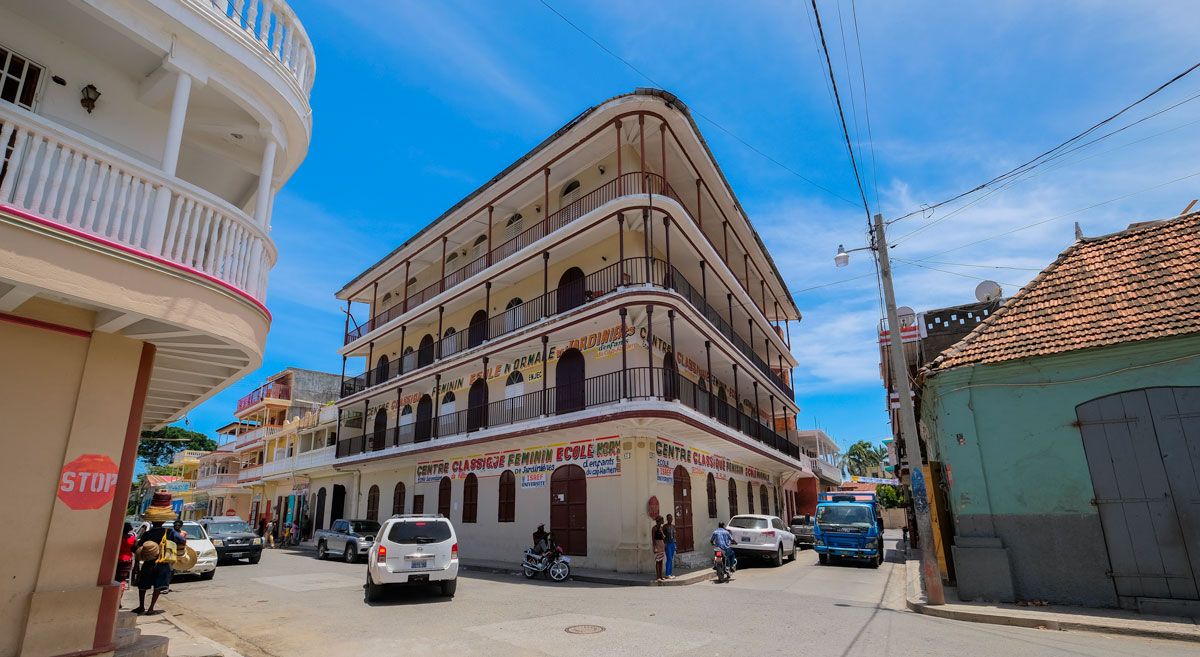 city street with traffic and old colonial buildings