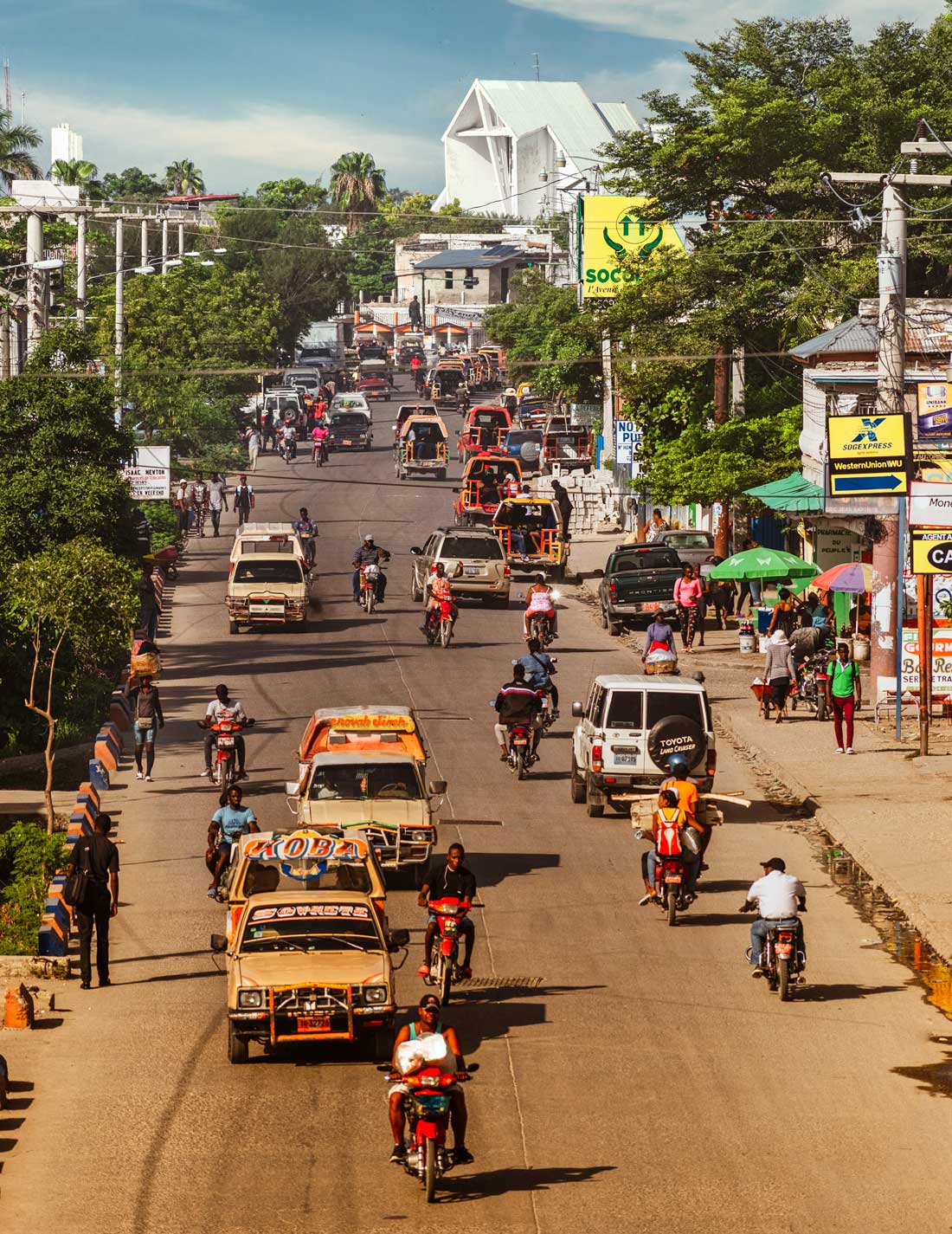 busy haitian city street with lots of traffic