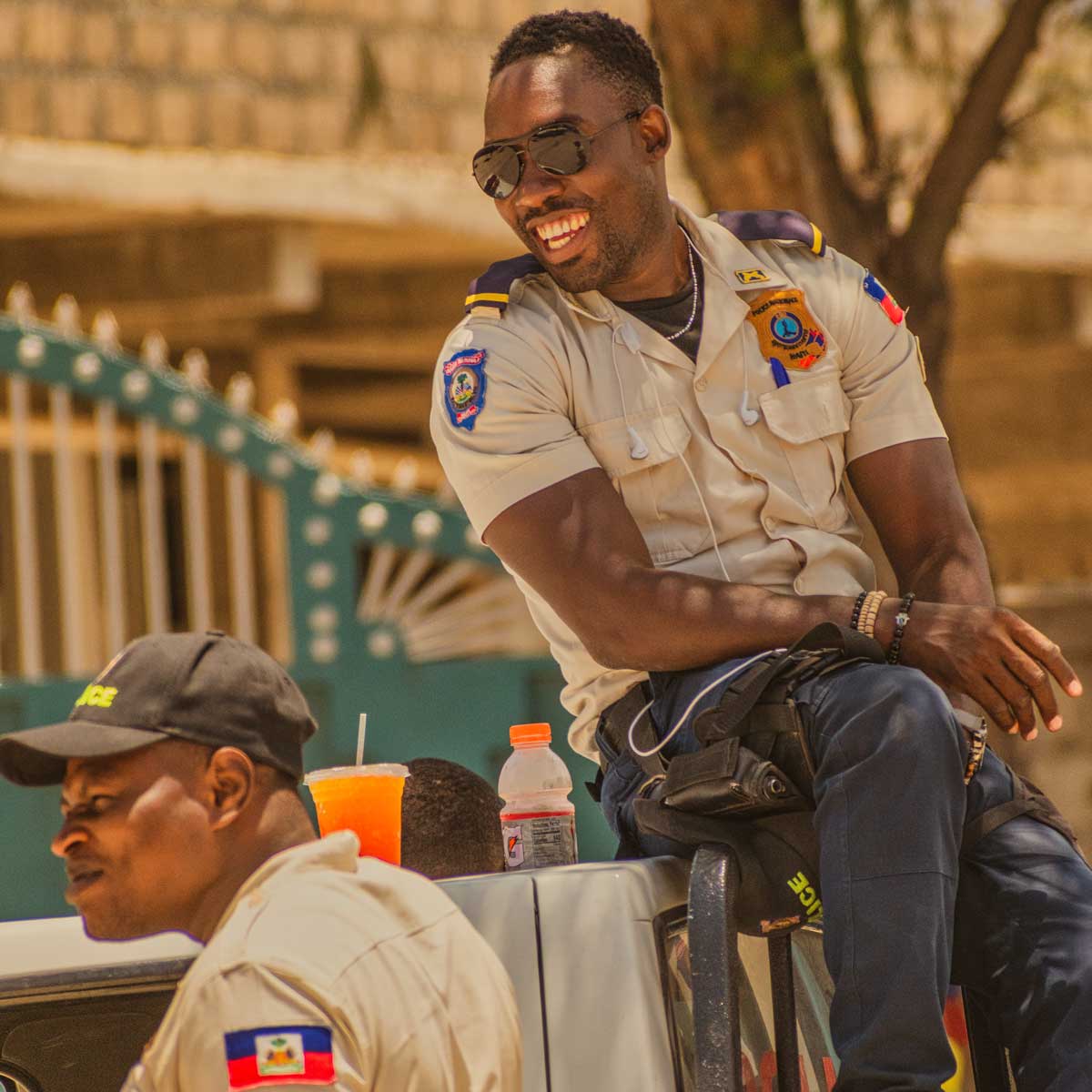 two haitian polica men smiling