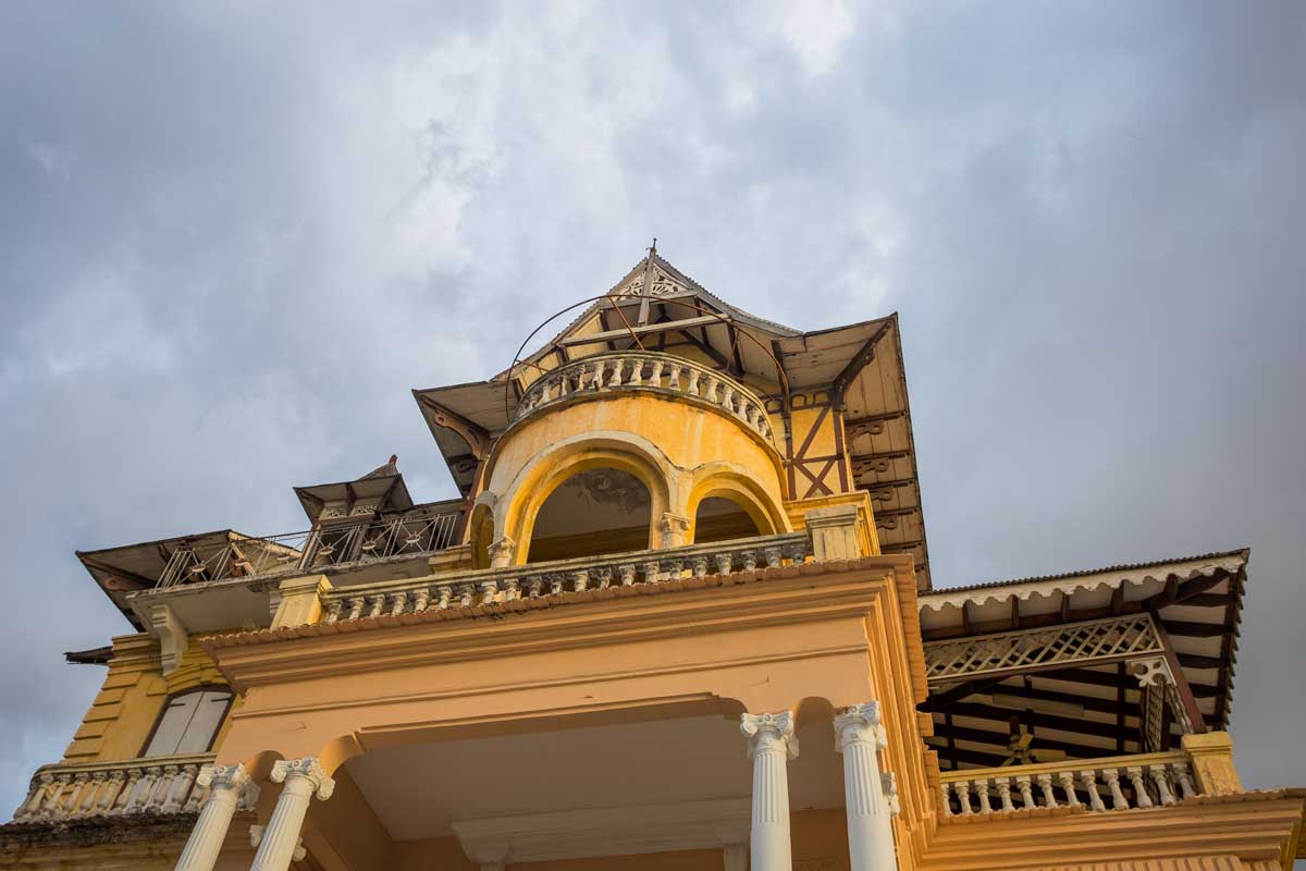 facade of old gothic gingerbread mansion with decorative fretworks and latticeworks