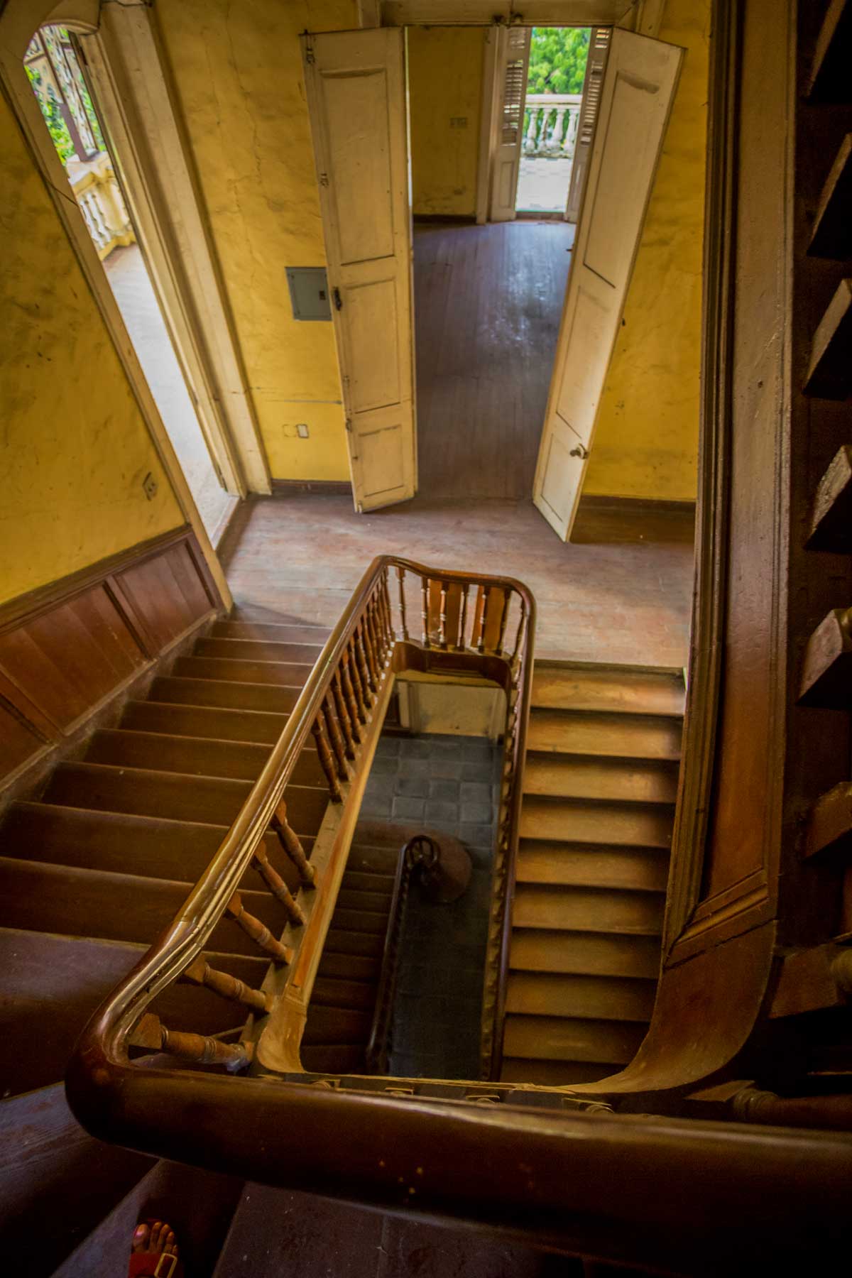 interior of gingerbread mansion with old wodden staicase 